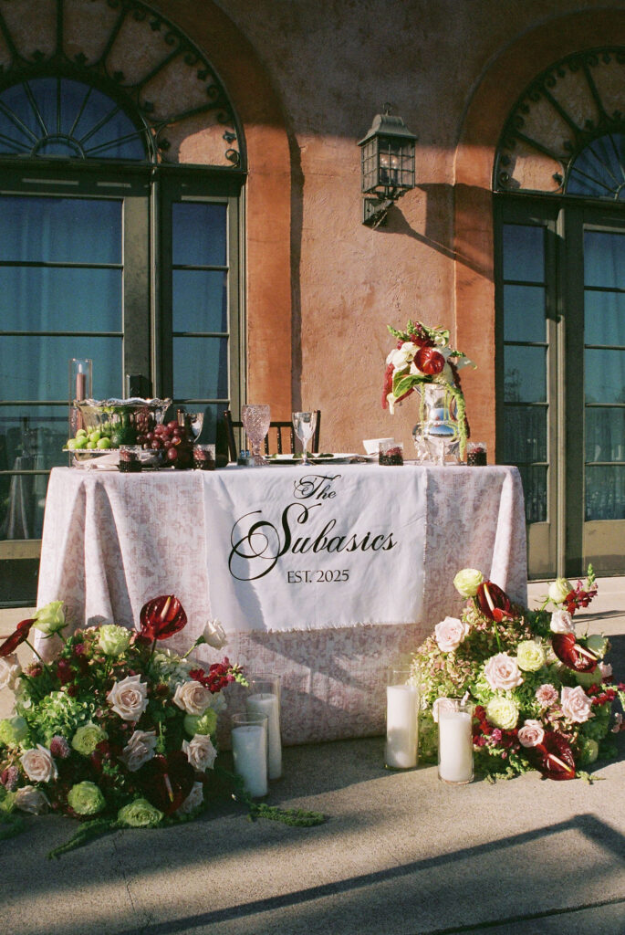 Film wedding photography of table with florals on top and surrounding it